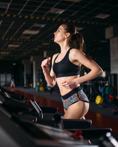 female-athlete-on-a-treadmill-in-sport-gym.jpg