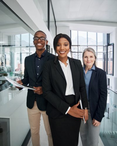 Portrait of a group of businesspeople working together in a modern office.